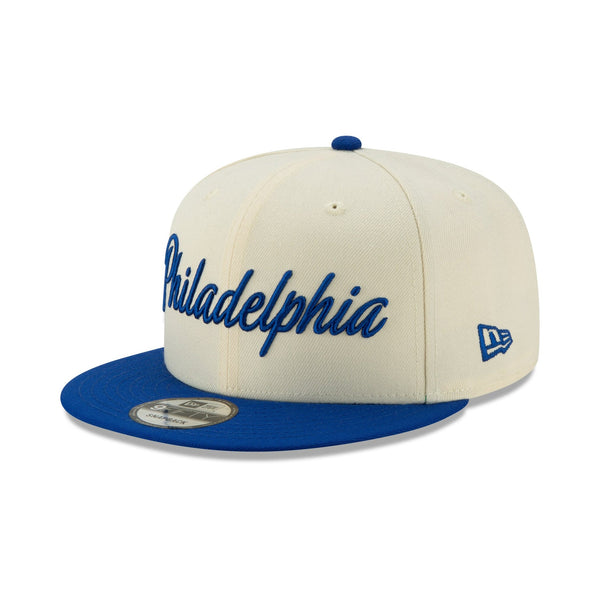 [12286123] Mens New Era Philadelphia 76ers - Cream/Blue City Series 950 Snapback