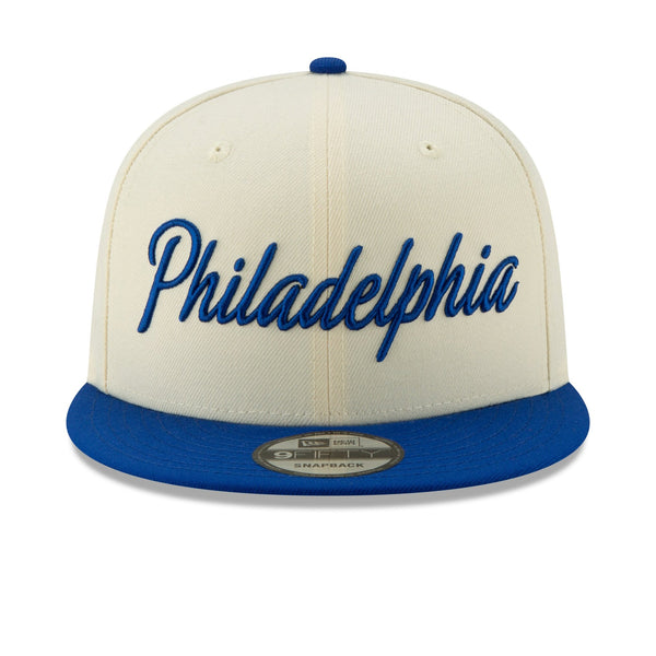 [12286123] Mens New Era Philadelphia 76ers - Cream/Blue City Series 950 Snapback