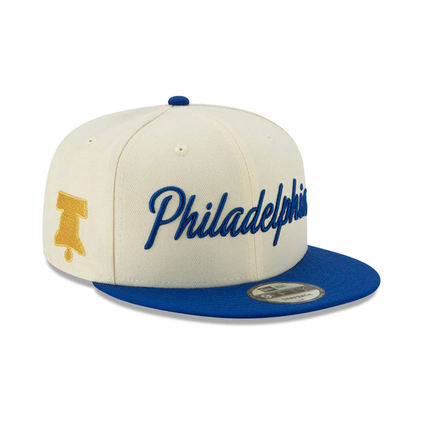 [12286123] Mens New Era Philadelphia 76ers - Cream/Blue City Series 950 Snapback